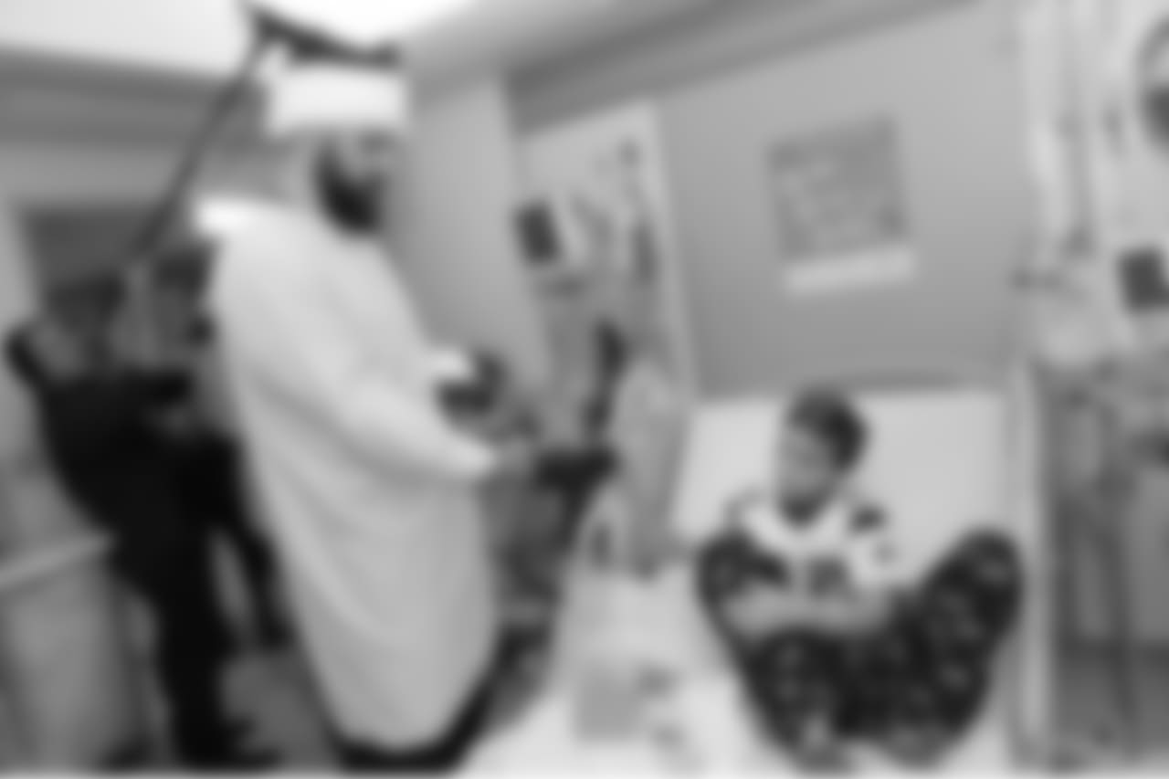 BOSTON, MA - DECEMBER 12: New England Patriot alumni Sebastian Vollmer visits with Mike at Boston Children's Hospital December 12, 2017 in Boston, Massachusetts. (Photo by Darren McCollester/Getty Images for Boston Children's Hospital)