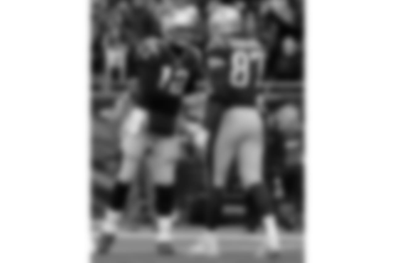 New England Patriots quarterback Tom Brady, left, celebrates his touchdown pass to tight end Rob Gronkowski (87) during the first half of an NFL football game against the Buffalo Bills, Sunday, Dec. 24, 2017, in Foxborough, Mass. (AP Photo/Charles Krupa)