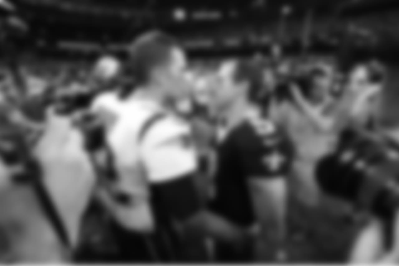 New England Patriots quarterback Tom Brady greets New Orleans Saints quarterback Drew Brees (9) after an NFL football game in New Orleans, Sunday, Sept. 17, 2017. The Patriots won 36-20. (AP Photo/Bill Feig)