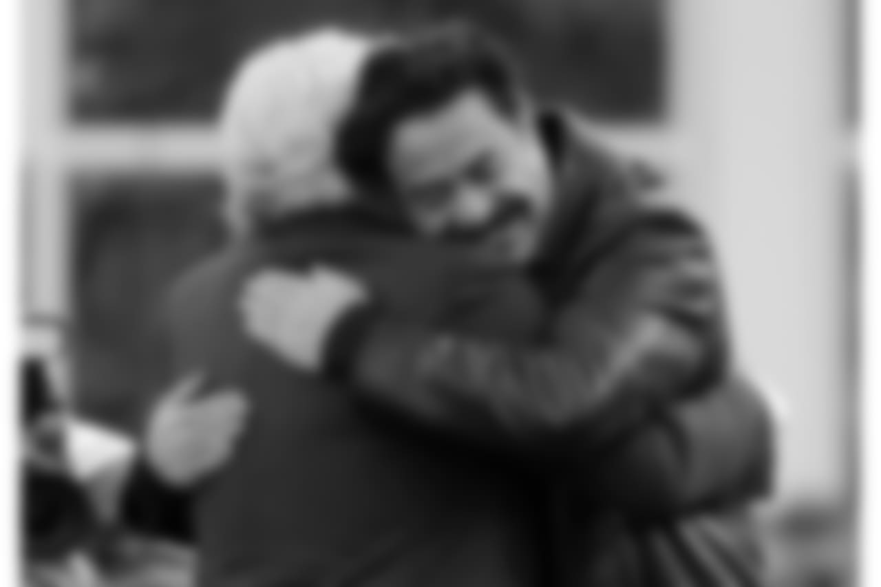 New England Patriots owner Robert Kraft, left, embraces Jacksonville Jaguars owner Shahid Khan before the AFC championship NFL football game, Sunday, Jan. 21, 2018, in Foxborough, Mass. (AP Photo/Steven Senne)