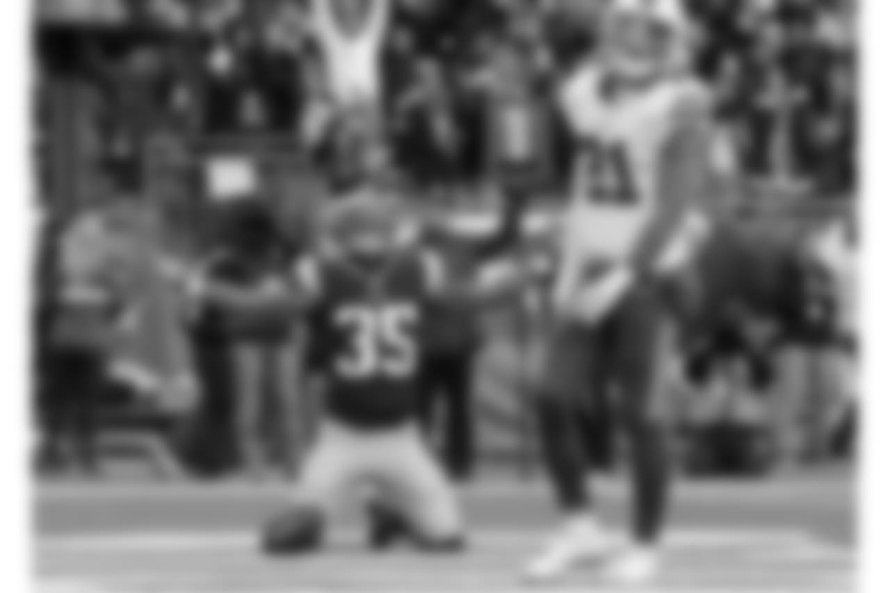 New England Patriots running back Mike Gillislee (35) celebrates his touchdown beside Buffalo Bills safety Jordan Poyer (21) during the second half of an NFL football game, Sunday, Dec. 24, 2017, in Foxborough, Mass. (AP Photo/Steven Senne)