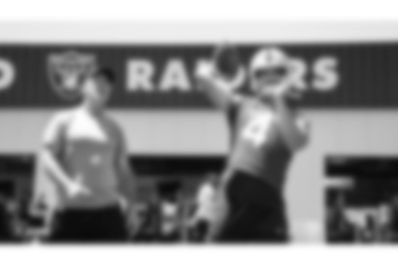 Oakland Raiders alumnus Rich Gannon and quarterback Derek Carr (4) at a Mandatory Mini Camp at the Oakland Raiders Practice Facility, Tuesday, June 12, 2018, in Alameda, California.