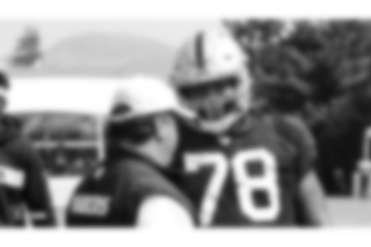Oakland Raiders defensive coordinator Paul Guenther and defensive tackle Justin Ellis (78) on the field for practice at 2018 Training Camp at The Oakland Raiders Napa Valley Training Complex, Thursday, August 2, 2018, in Napa, California.