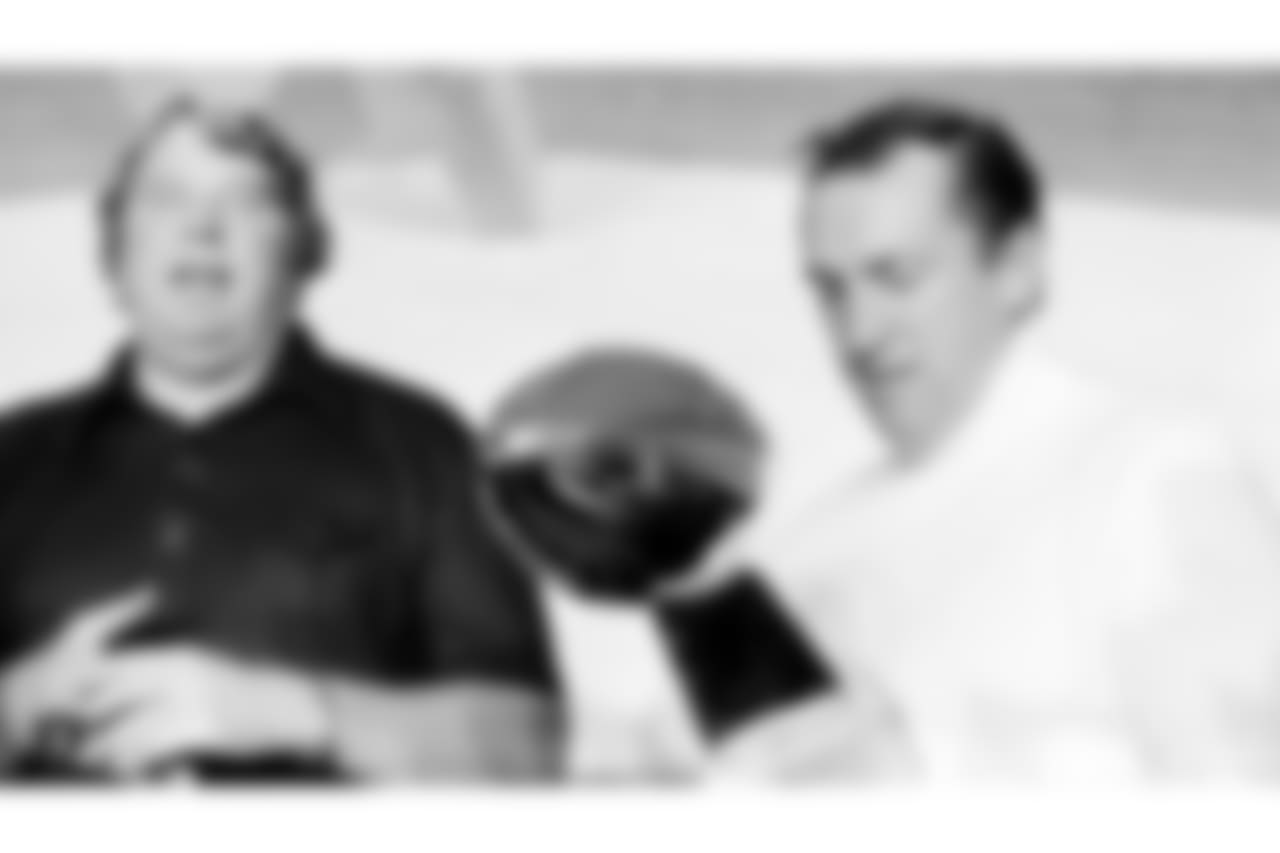 FILE - In this Jan. 9, 1977, file photo, Oakland Raiders coach John Madden, left, talks as team owner Al Davis holds the Vince Lombardi Trophy after the Raiders' 32-14 victory over the Minnesota Vikings in Super Bowl XI in Pasadena, Calif. Davis, the Hall of Fame owner of the Raiders known for his rebellious spirit, has died, the team announced on Saturday, Oct. 8, 2011. (AP Photo/File)