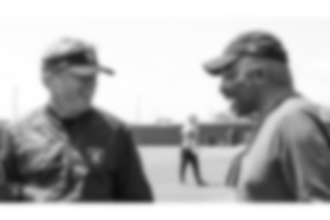 Oakland Raiders head coach Jon Gruden and alumnus Clem Daniels at an Organized Team Activity (OTA) at the Oakland Raiders Practice Facility, Thursday, May 31, 2018, in Alameda, California.