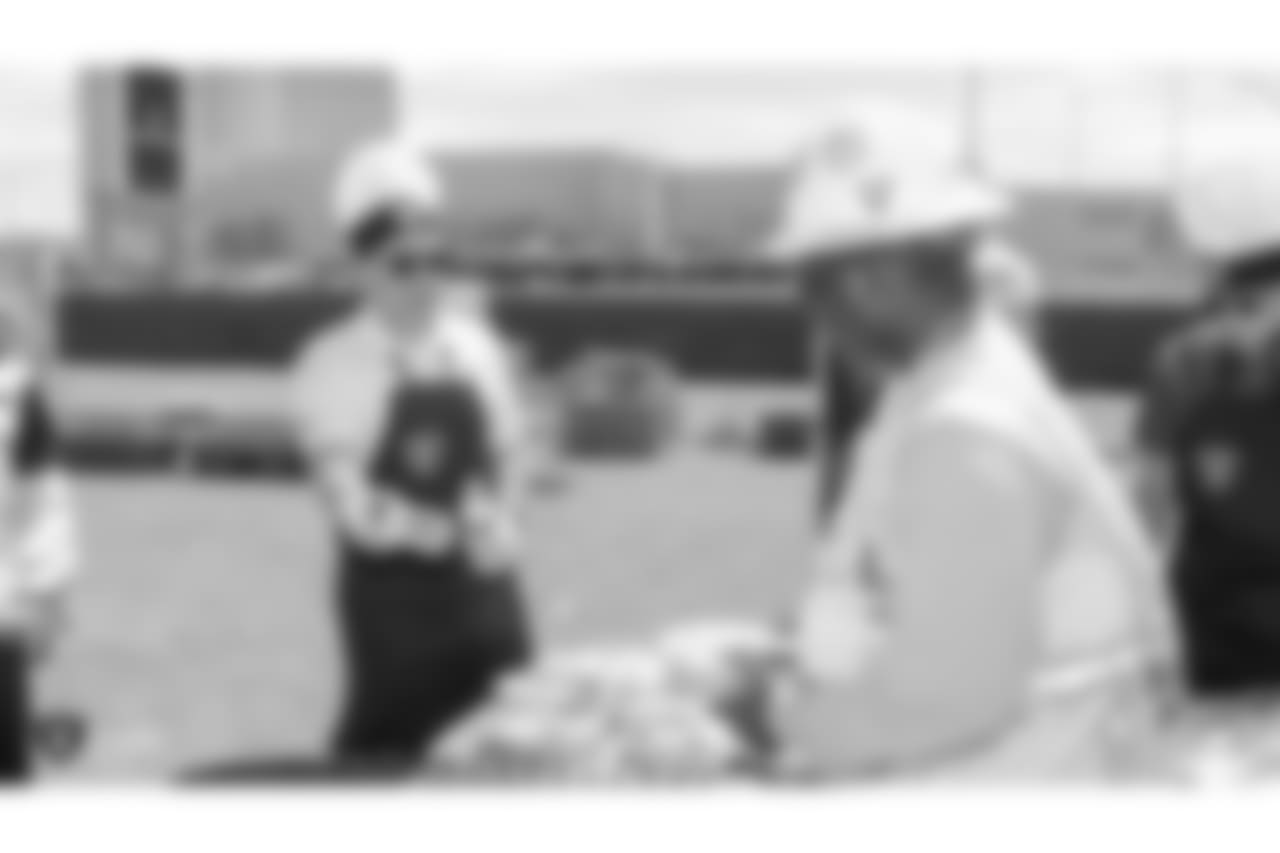 Oakland Raiders president Marc Badain, and other staff members from The Oakland Raiders front office spend the day with construction workers of the Las Vegas Stadium worksite by handing out lunches and sharing a meal, Wednesday, June 28, 2018, at the Las Vegas Stadium worksite in Las Vegas, Nevada.