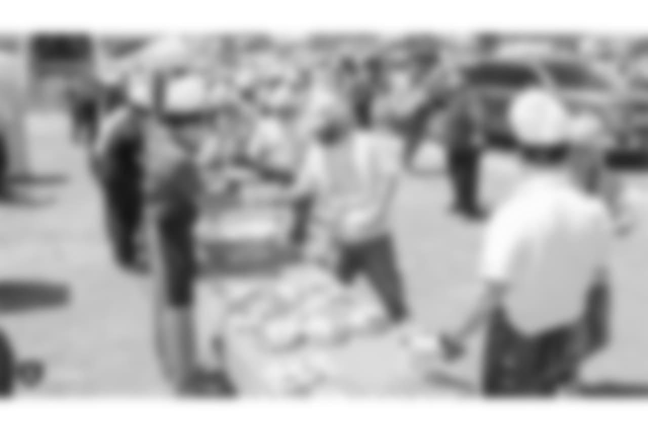 Staff members from The Oakland Raiders front office spend the day with construction workers of the Las Vegas Stadium worksite by handing out lunches and sharing a meal, Wednesday, June 28, 2018, at the Las Vegas Stadium worksite in Las Vegas, Nevada.