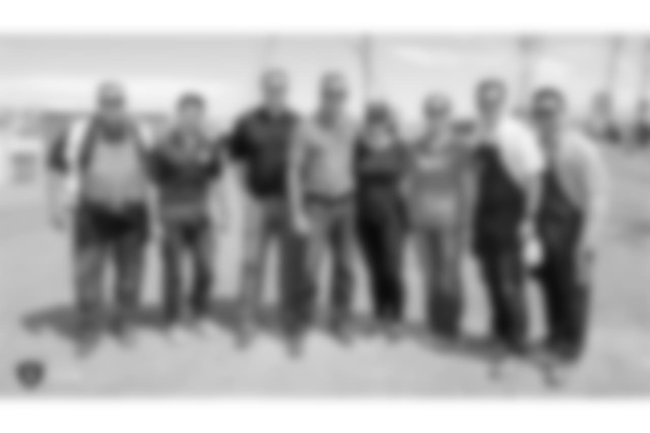 Oakland Raiders vice president of security Dean Stavert, vice president of information technology Matt Pasco, senior vice president Ed Villanueva, and staff members from The Oakland Raiders front office spend the day with construction workers of the Las Vegas Stadium worksite by handing out lunches and sharing a meal, Wednesday, June 28, 2018, at the Las Vegas Stadium worksite in Las Vegas, Nevada.