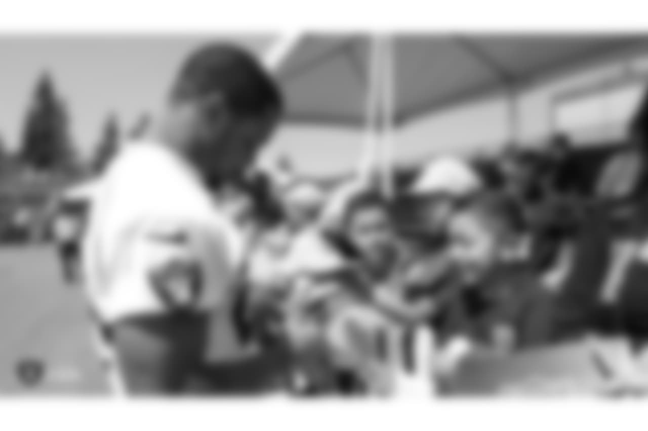 Oakland Raiders running back Doug Martin (28) signs autographs for fans after practice at 2018 Training Camp at The Oakland Raiders Napa Valley Training Complex, Monday, August 6, 2018, in Napa, California.