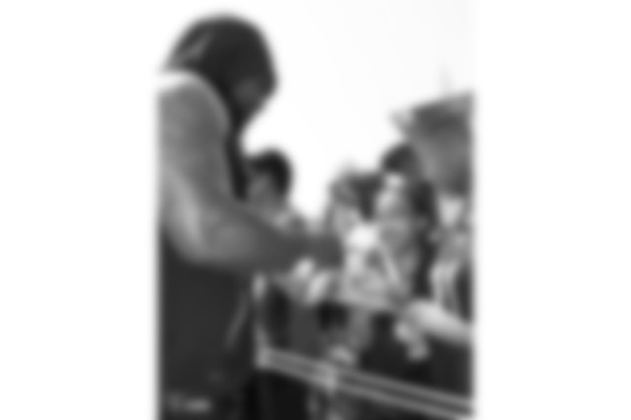 Oakland Raiders running back Marshawn Lynch (24) autographs for fans after practice at 2018 Training Camp at The Oakland Raiders Napa Valley Training Complex, Wednesday, August 1, 2018, in Napa, California.