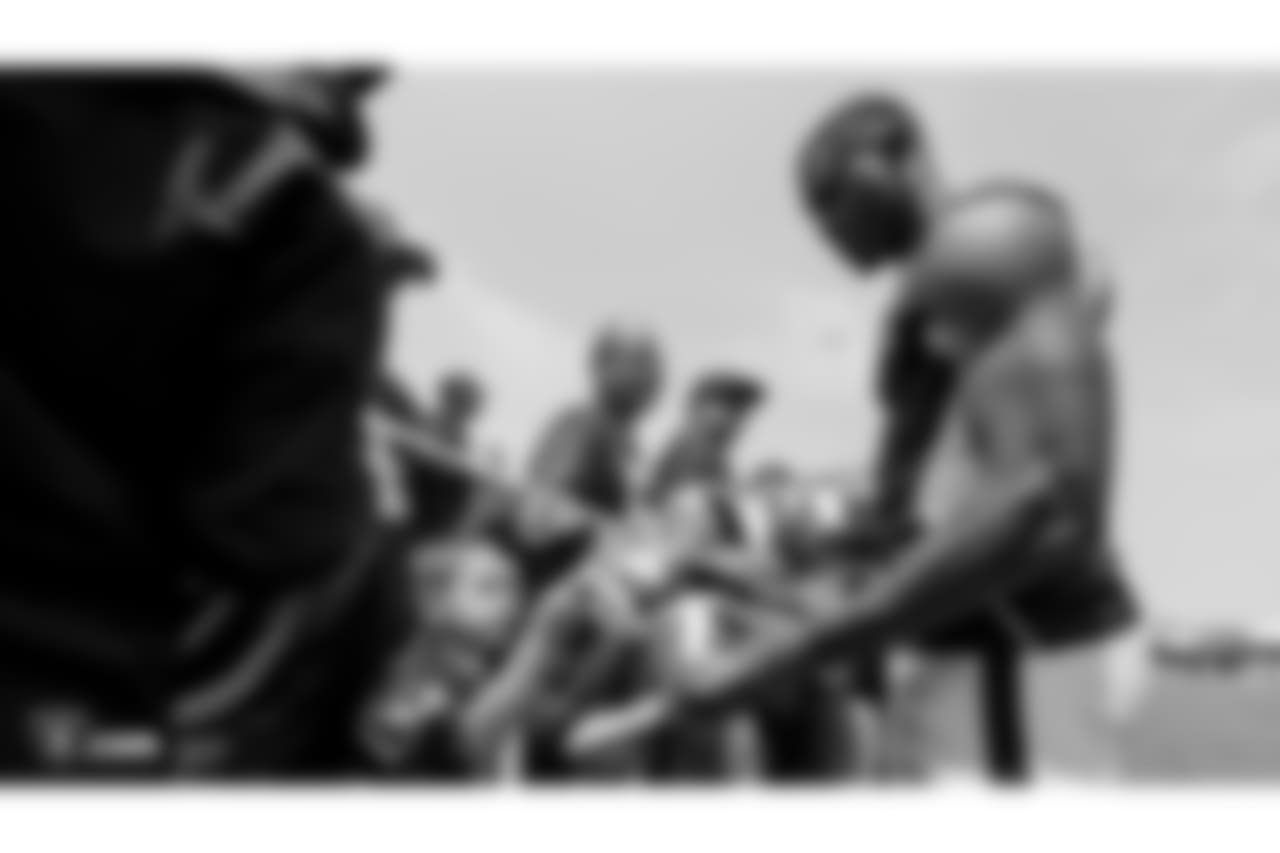 Oakland Raiders wide receiver Johnny Holton (16) signs autographs for fans after practice at 2018 Training Camp at The Oakland Raiders Napa Valley Training Complex, Sunday, July 29, 2018, in Napa, California.