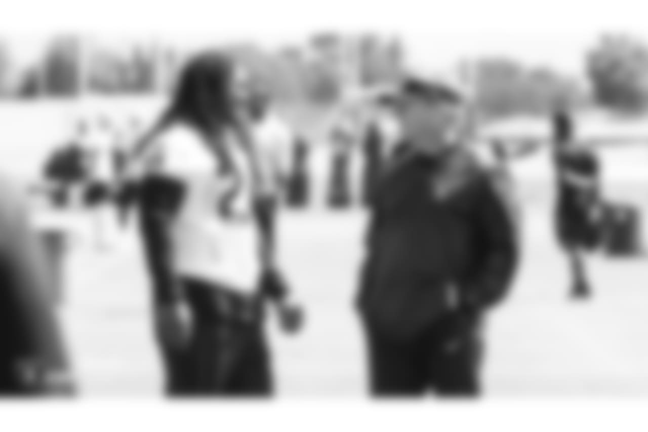 Oakland Raiders running back Marshawn Lynch (24) and head coach Jon Gruden at an Organized Team Activity (OTA) at the Oakland Raiders Practice Facility, Thursday, May 31, 2018, in Alameda, California.