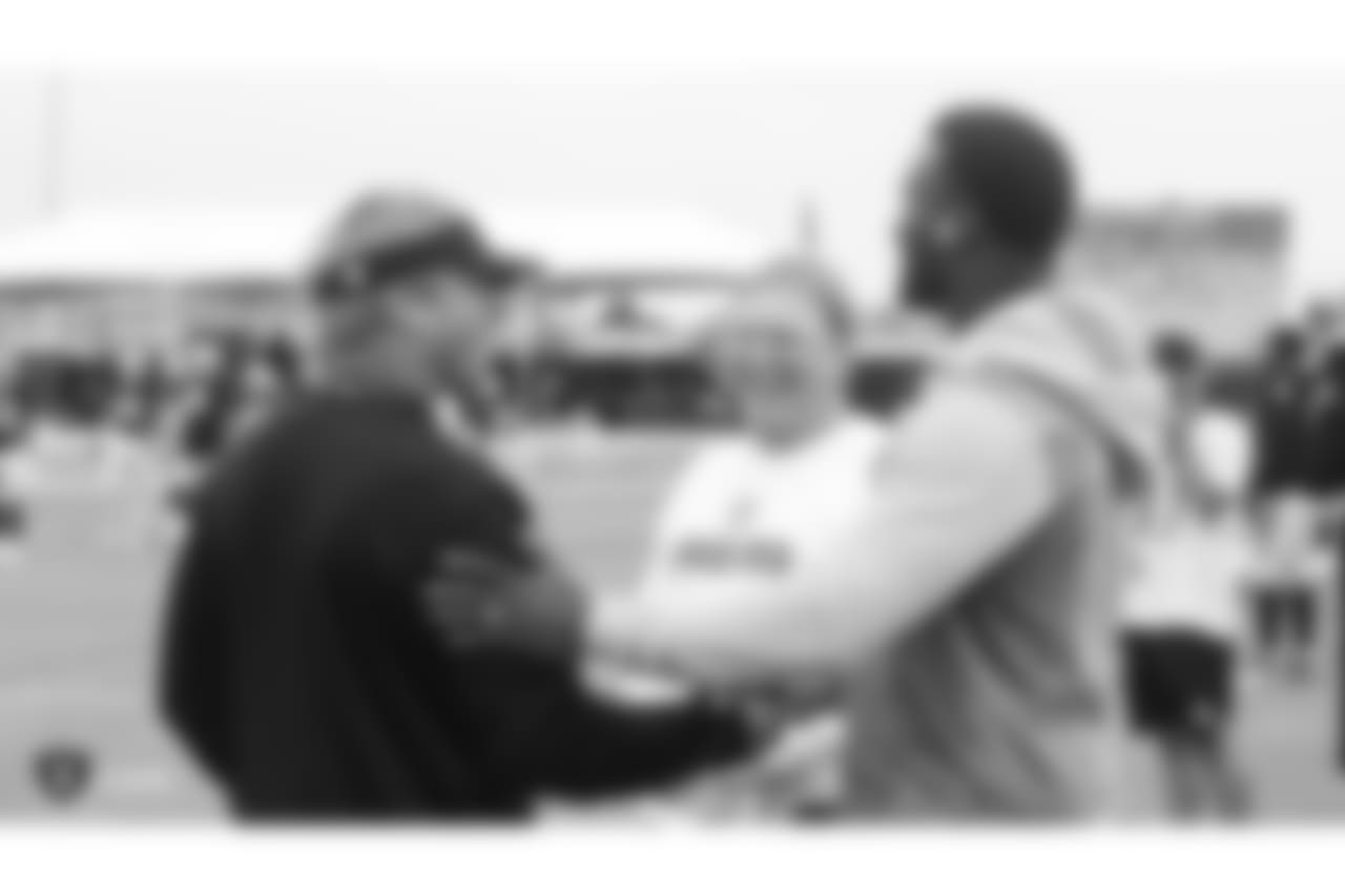 Oakland Raiders with owner Mark Davis, head coach Jon Gruden, and alumnus James Jones on the field for practice at 2018 Training Camp at The Oakland Raiders Napa Valley Training Complex, Wednesday, August 8, 2018, in Napa, California.