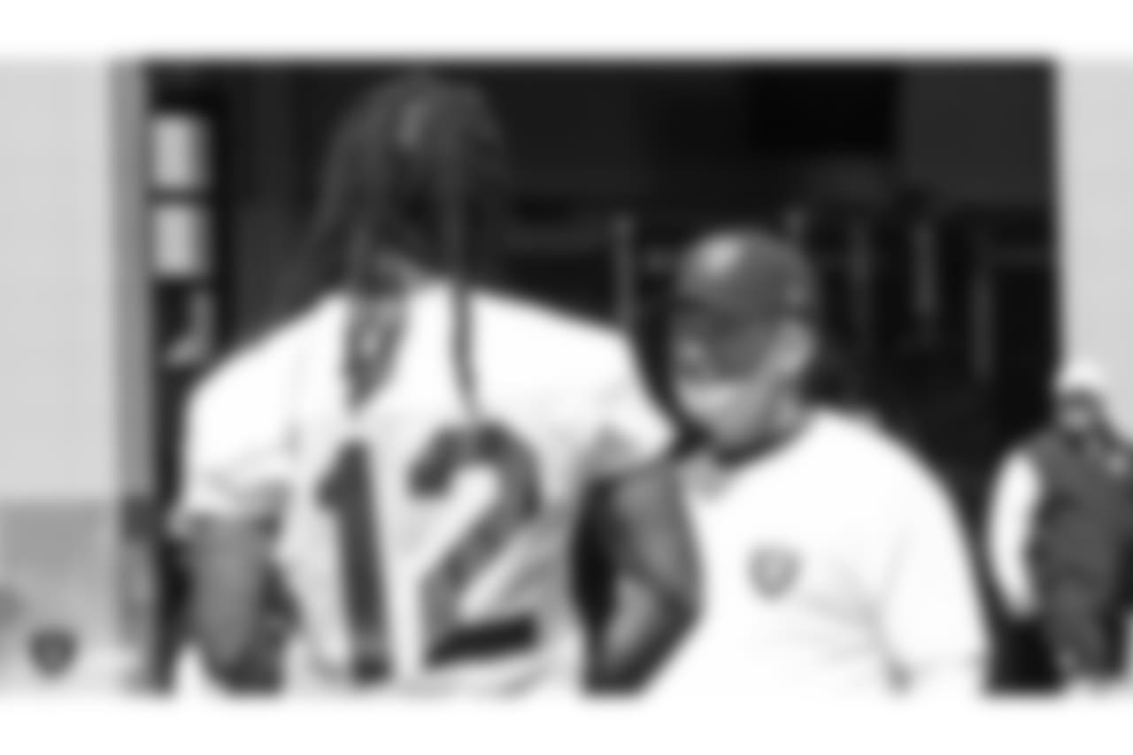 Oakland Raiders head coach Jon Gruden and wide receiver Martavis Bryant (12) at an Organized Team Activity (OTA) at the Oakland Raiders Practice Facility, Tuesday, May 29, 2018, in Alameda, California.