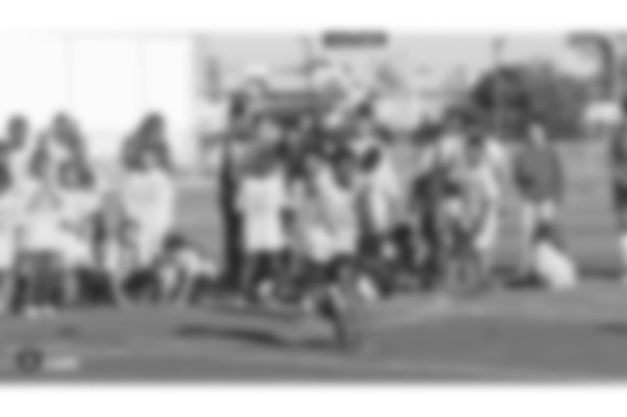 The Oakland Raiders head coach Jon Gruden presents a donation of football gear and checks for $50,000 by Dicks Sporting Goods Foundation's Sports Matters to both San Leandro Crusaders and East Bay Panthers' youth football teams. Accepting the donations were the San Leandro Crusaders' head coach Daniel Rivera and East Bay Panthers' head coach Jacob Davis, at Burrell Field, Tuesday, July 17, 2018, in San Leandro, California.