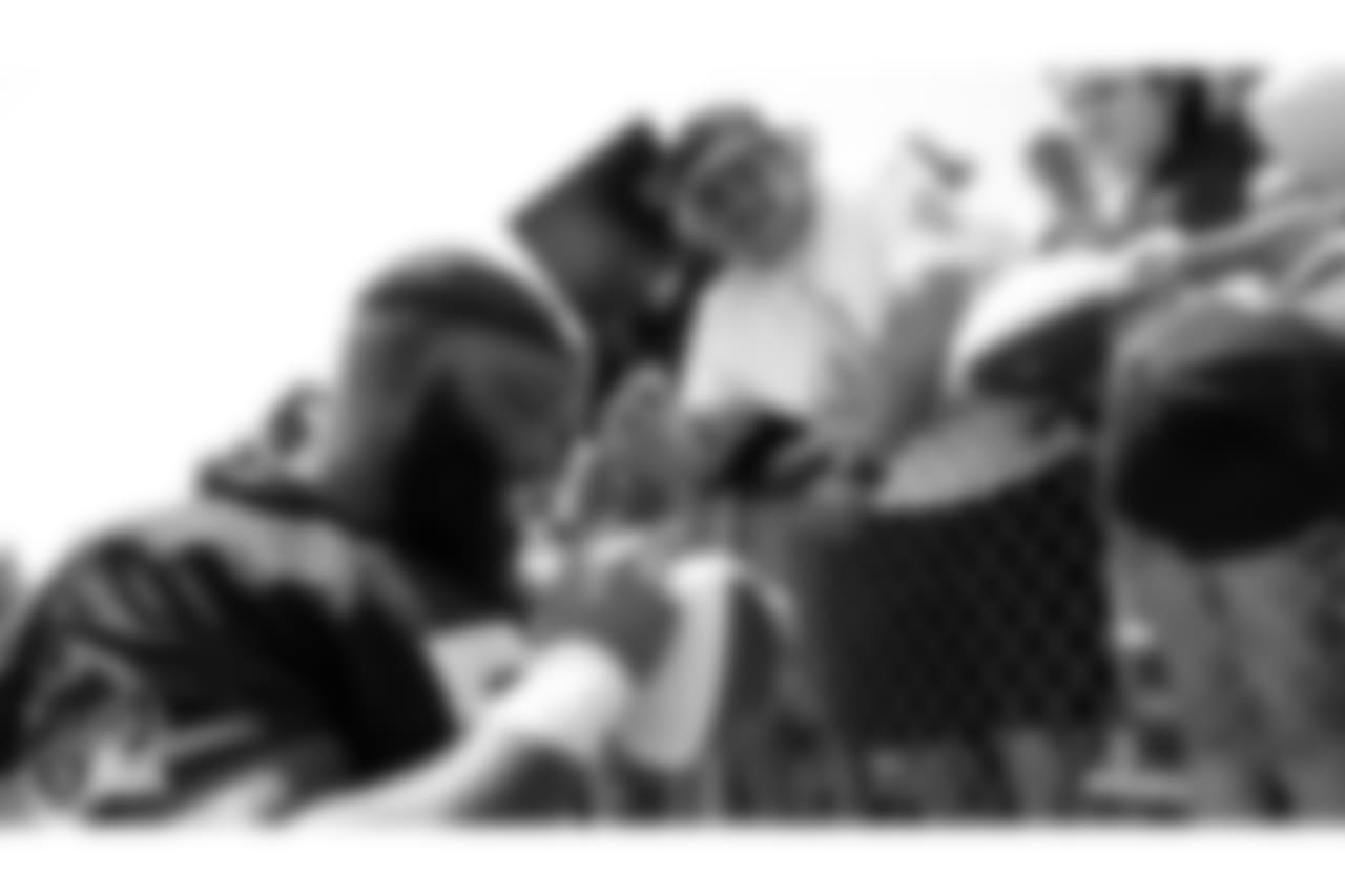 Oakland Raiders defensive tackle Justin Ellis (78) signs autographs for fans after practice at 2018 Training Camp at Memorial Stadium, Saturday, July 28, 2018, in Napa, California.