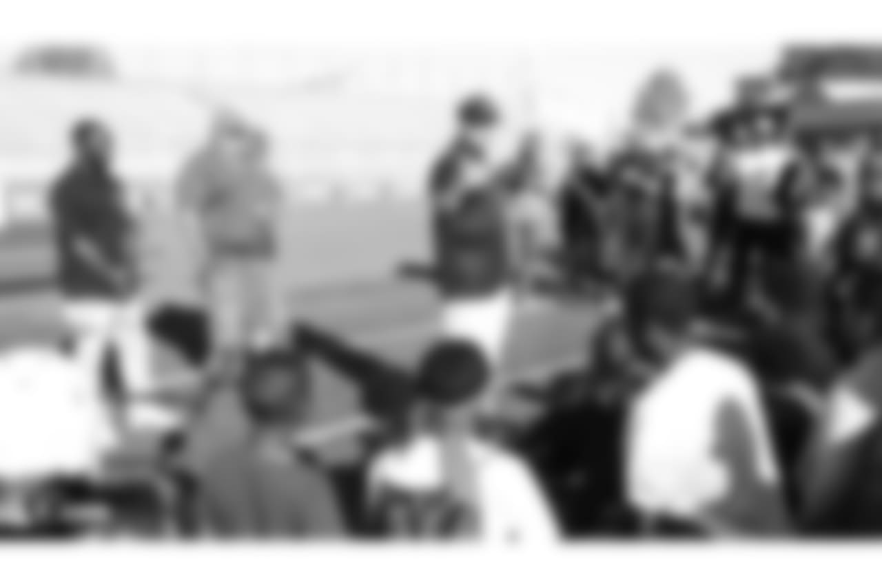 The Oakland Raiders head coach Jon Gruden presents a donation of football gear and checks for $50,000 by Dicks Sporting Goods Foundation's Sports Matters to both San Leandro Crusaders and East Bay Panthers' youth football teams. Accepting the donations were the San Leandro Crusaders' head coach Daniel Rivera and East Bay Panthers' head coach Jacob Davis, at Burrell Field, Tuesday, July 17, 2018, in San Leandro, California.