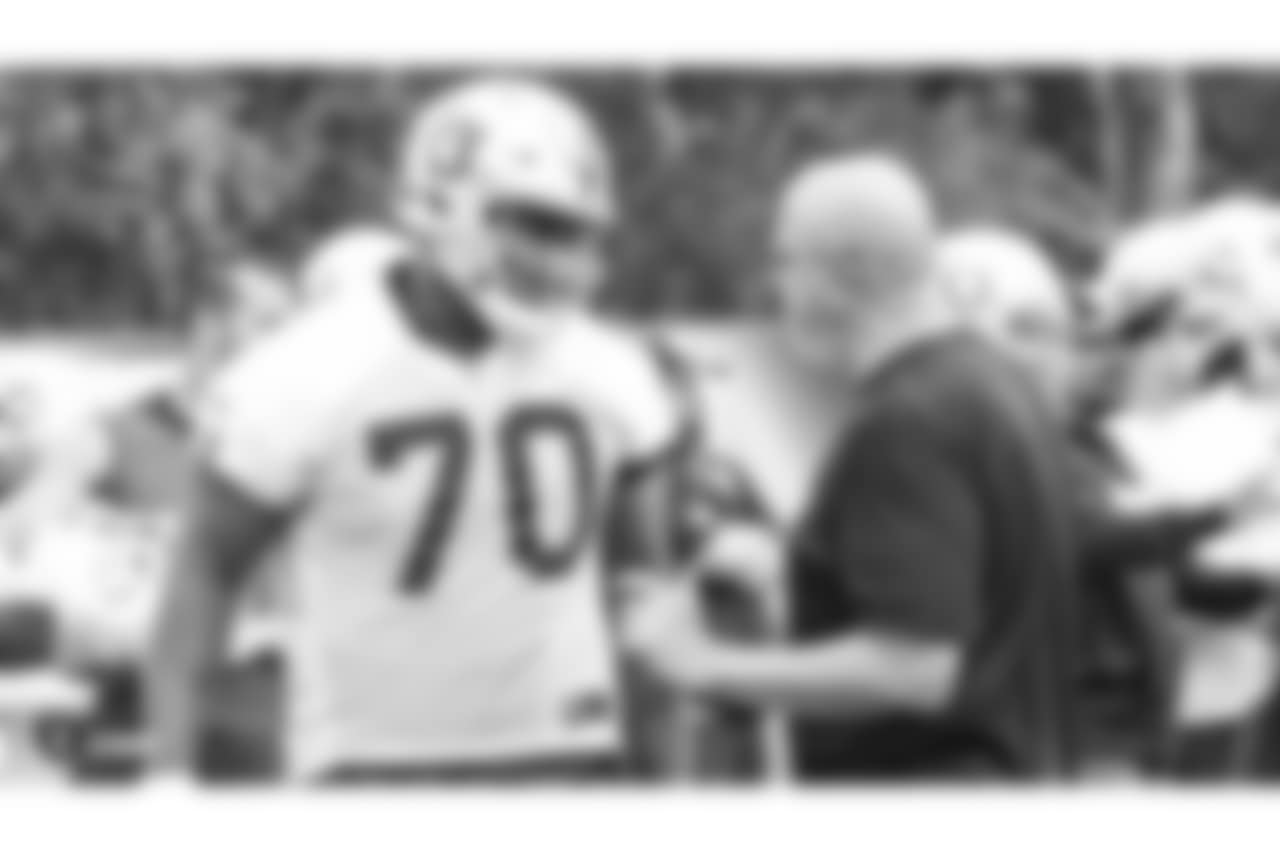 Oakland Raiders offensive guard Kelechi Osemele (70) and offensive line coach Tom Cable at an Organized Team Activity (OTA) at the Oakland Raiders Practice Facility, Wednesday, May 30, 2018, in Alameda, California.