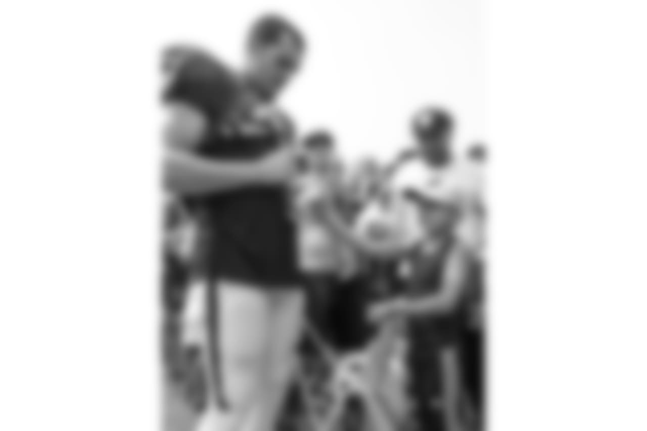 Oakland Raiders quarterback Derek Carr (4) signs autographs for fans after practice at 2018 Training Camp at The Oakland Raiders Napa Valley Training Complex, Tuesday, August 7, 2018, in Napa, California.