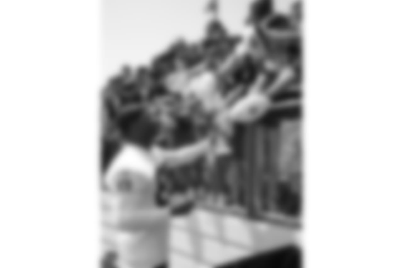 Oakland Raiders wide receiver Amari Cooper (89) signs autographs for fans after practice at 2018 Training Camp at Memorial Stadium, Saturday, July 28, 2018, in Napa, California.