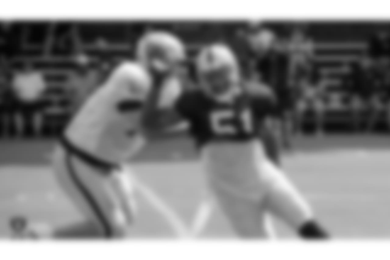 Oakland Raiders offensive tackle Kolton Miller (77) and outside linebacker Bruce Irvin (51) on the field for practice at 2018 Training Camp at The Oakland Raiders Napa Valley Training Complex, Thursday, August 2, 2018, in Napa, California.