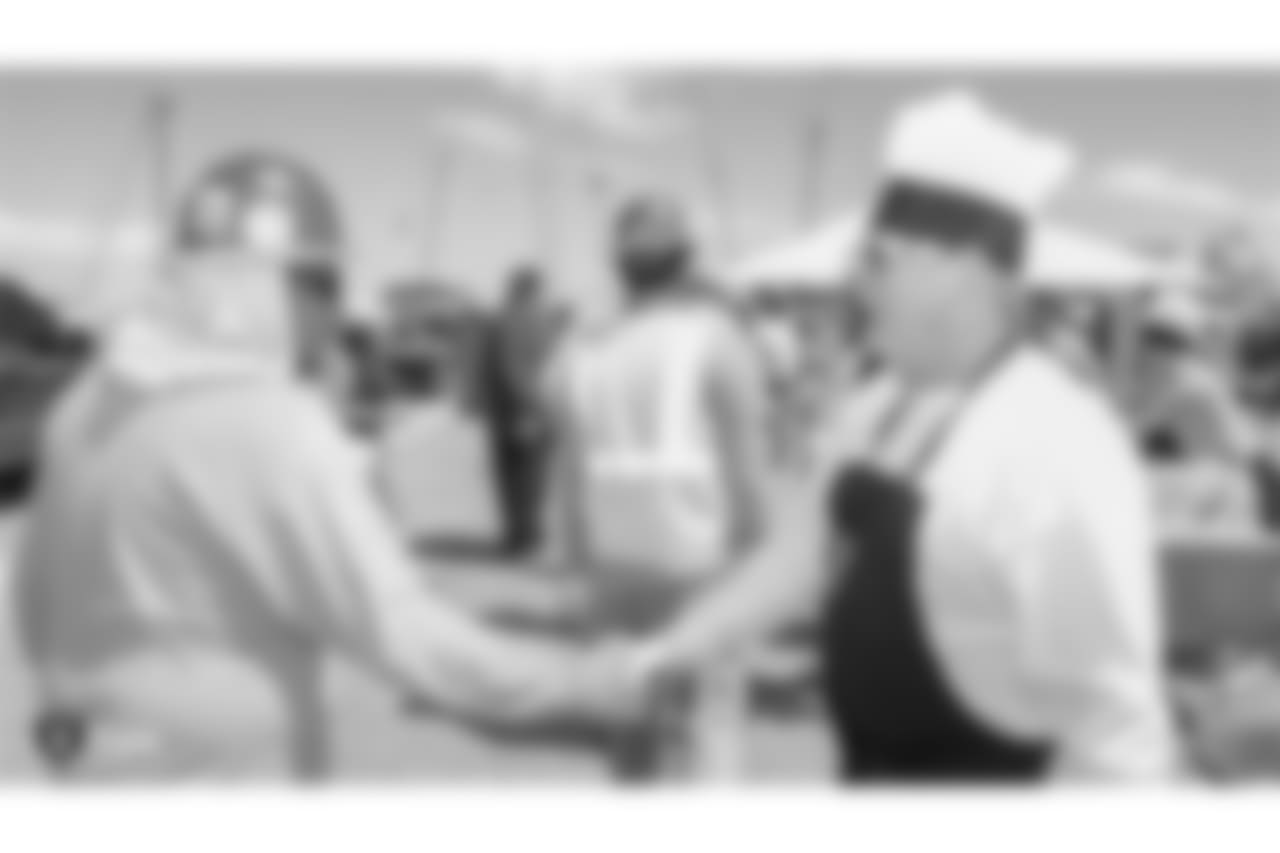 Oakland Raiders owner, Mark Davis, and other staff members from The Oakland Raiders front office spend the day with construction workers of the Las Vegas Stadium worksite by handing out lunches and sharing a meal, Wednesday, June 28, 2018, at the Las Vegas Stadium worksite in Las Vegas, Nevada.