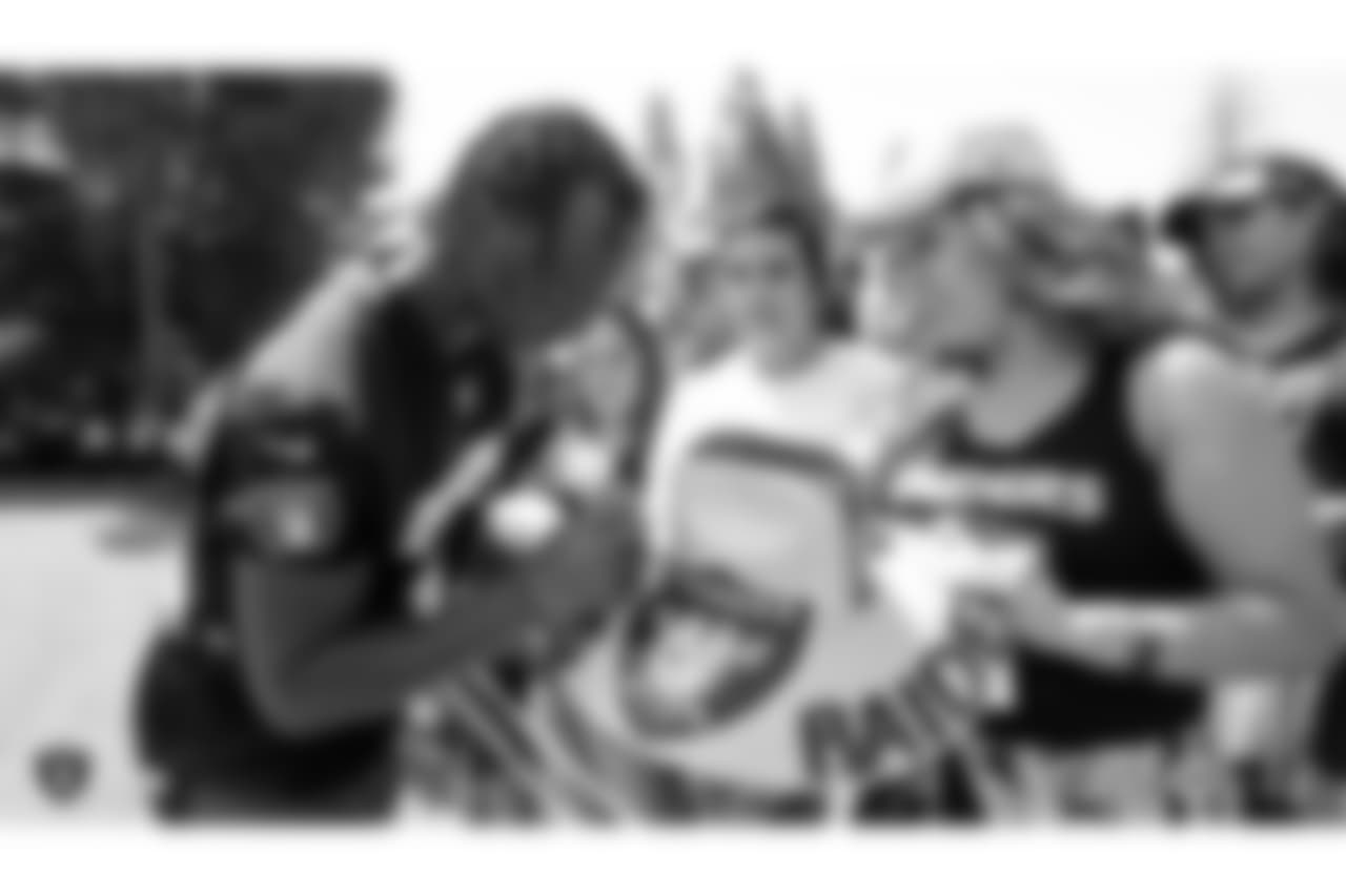 Oakland Raiders defensive back Antonio Hamilton (32) signs autographs for fans after practice at 2018 Training Camp at The Oakland Raiders Napa Valley Training Complex, Monday, August 6, 2018, in Napa, California.