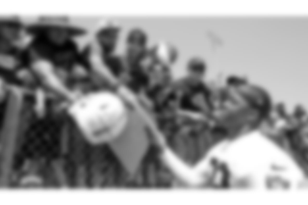 Oakland Raiders wide receiver Amari Cooper (89) signs autographs for fans after practice at 2018 Training Camp at Memorial Stadium, Saturday, July 28, 2018, in Napa, California.