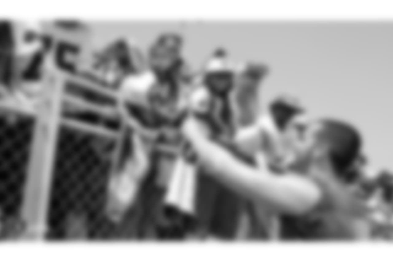 Oakland Raiders quarterback Derek Carr (4) signs autographs for fans after practice at 2018 Training Camp at Memorial Stadium, Saturday, July 28, 2018, in Napa, California.