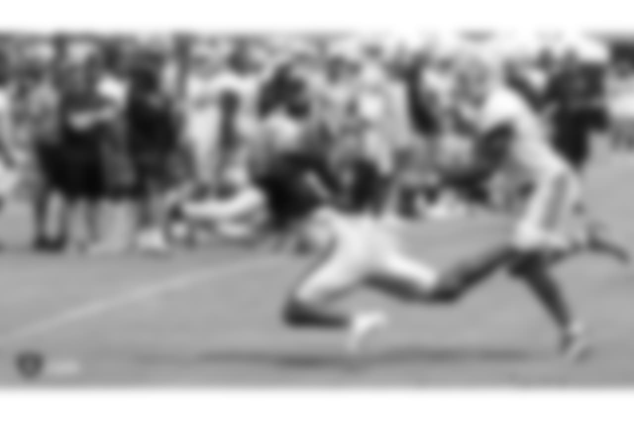 Oakland Raiders wide receiver Keon Hatcher (14) with Detroit Lions (41) strong safety Rolan Mulligan on the field for practice at 2018 Training Camp at The Oakland Raiders Napa Valley Training Complex, Wednesday, August 8, 2018, in Napa, California.