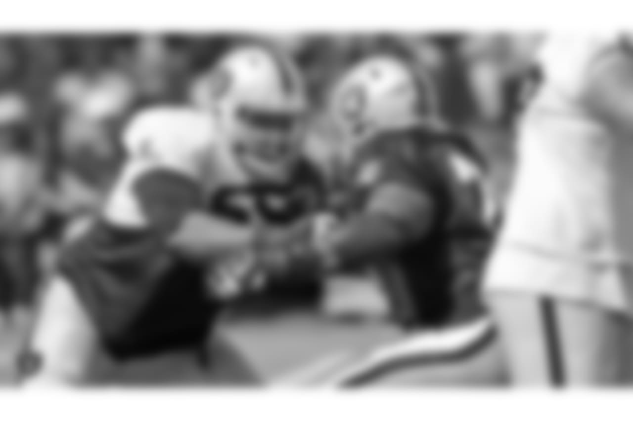 Oakland Raiders offensive guard Jordan Simmons (65) and defensive tackle Maurice Hurst (73) on the field for practice at 2018 Training Camp at The Oakland Raiders Napa Valley Training Complex, Monday, August 6, 2018, in Napa, California.