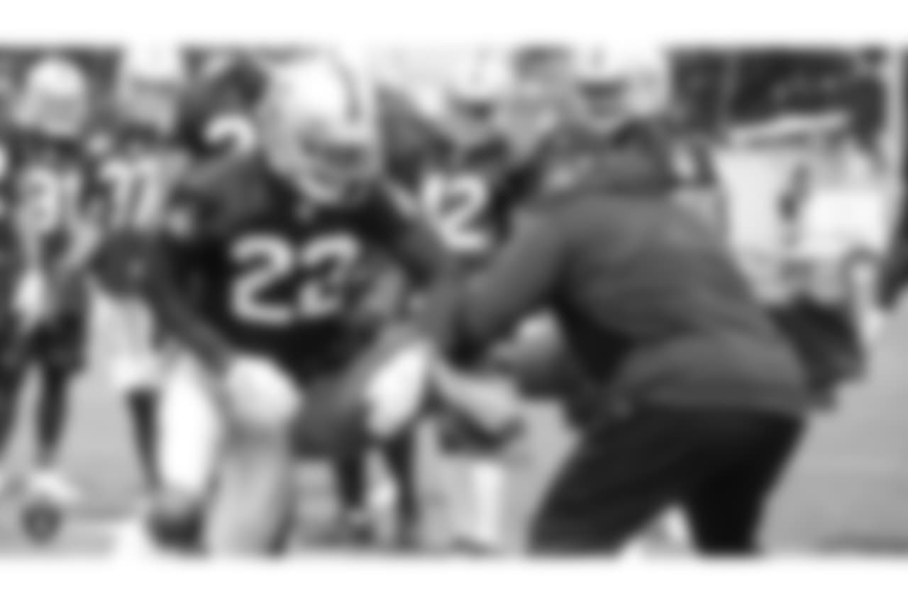 Oakland Raiders assistant defensive line coach Marco Coleman and cornerback Rahsaan Melvin (22) at an Organized Team Activity (OTA) at the Oakland Raiders Practice Facility, Wednesday, May 30, 2018, in Alameda, California.