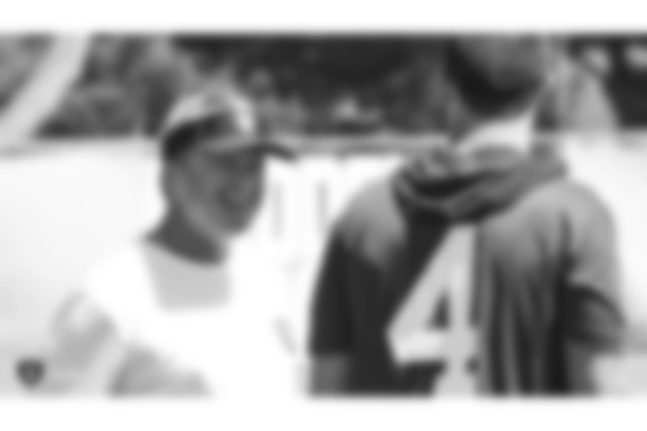 Oakland Raiders head coach Jon Gruden and quarterback Derek Carr (4) at an offseason program at the Oakland Raiders Practice Facility, Friday, June 1, 2018, in Alameda, California.
