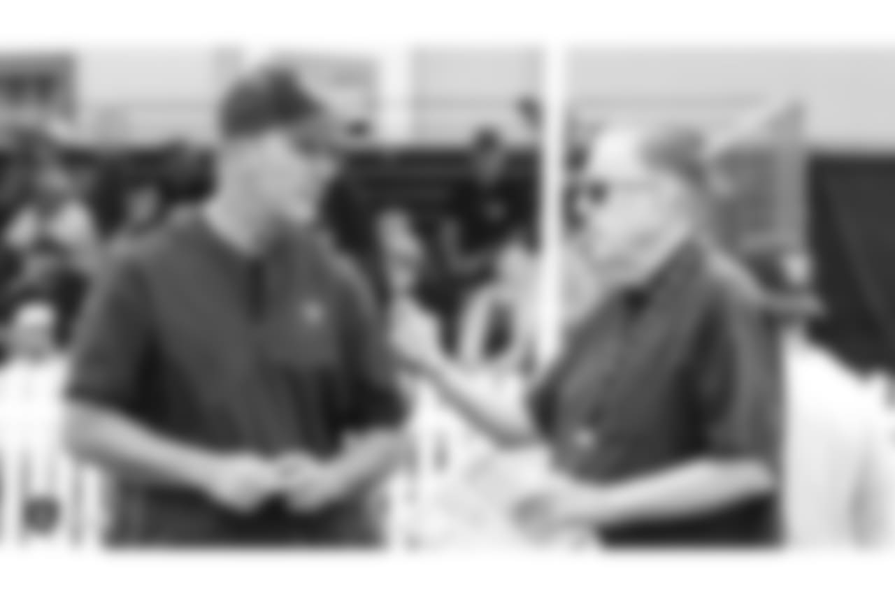 Oakland Raiders alumnus Rich Gannon talking to Raiders play-by-play announcer Brent Musburger on the field for practice at 2018 Training Camp at The Oakland Raiders Napa Valley Training Complex, Wednesday, August 8, 2018, in Napa, California.