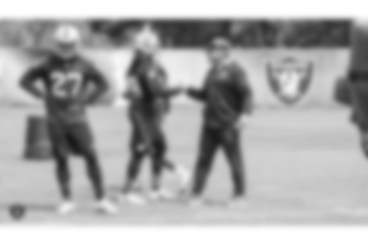Oakland Raiders free safety Reggie Nelson (27), cornerback Leon Hall (29), and head coach Jon Gruden at an Organized Team Activity (OTA) at the Oakland Raiders Practice Facility, Wednesday, May 30, 2018, in Alameda, California.