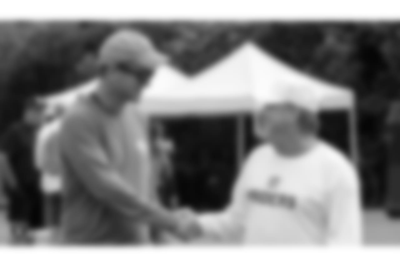 Former NFL quarterback Peyton Manning and Oakland Raiders owner Mark Davis on the field for practice at 2018 Training Camp at The Oakland Raiders Napa Valley Training Complex, Thursday, August 2, 2018, in Napa, California.
