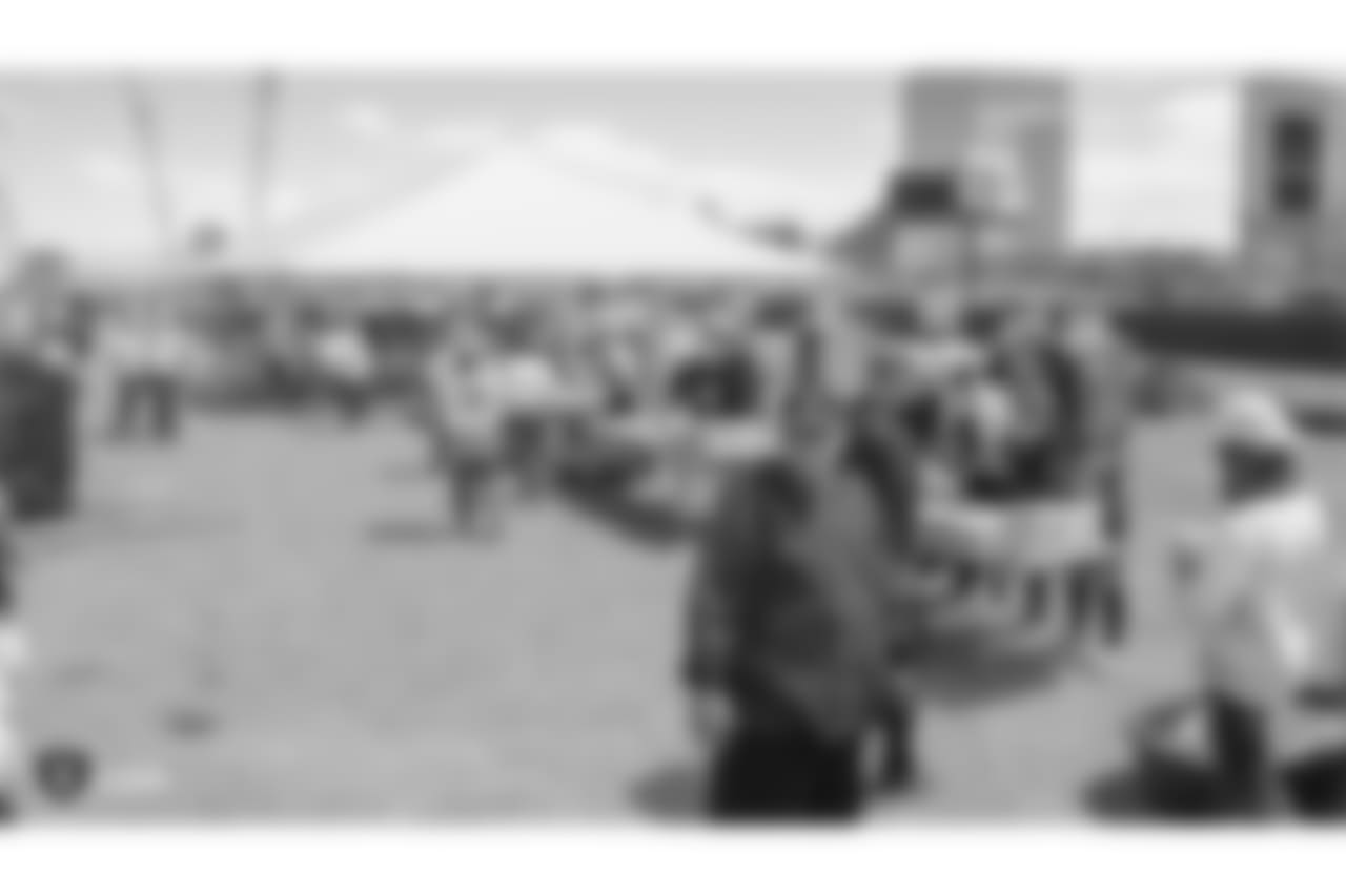 Staff members from The Oakland Raiders front office spend the day with construction workers of the Las Vegas Stadium worksite by handing out lunches and sharing a meal, Wednesday, June 28, 2018, at the Las Vegas Stadium worksite in Las Vegas, Nevada.