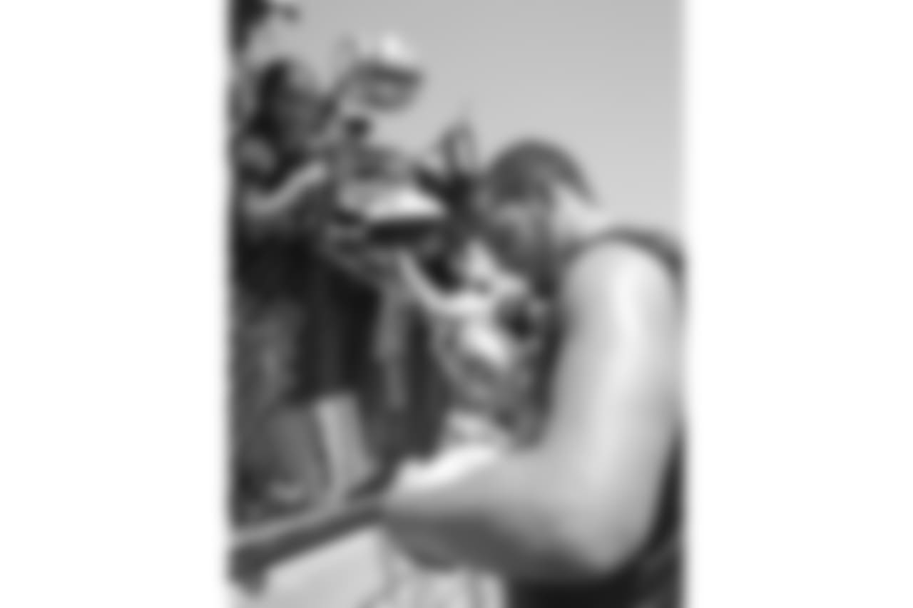 Oakland Raiders quarterback Derek Carr (4) signs autographs for fans after practice at 2018 Training Camp at Memorial Stadium, Saturday, July 28, 2018, in Napa, California.