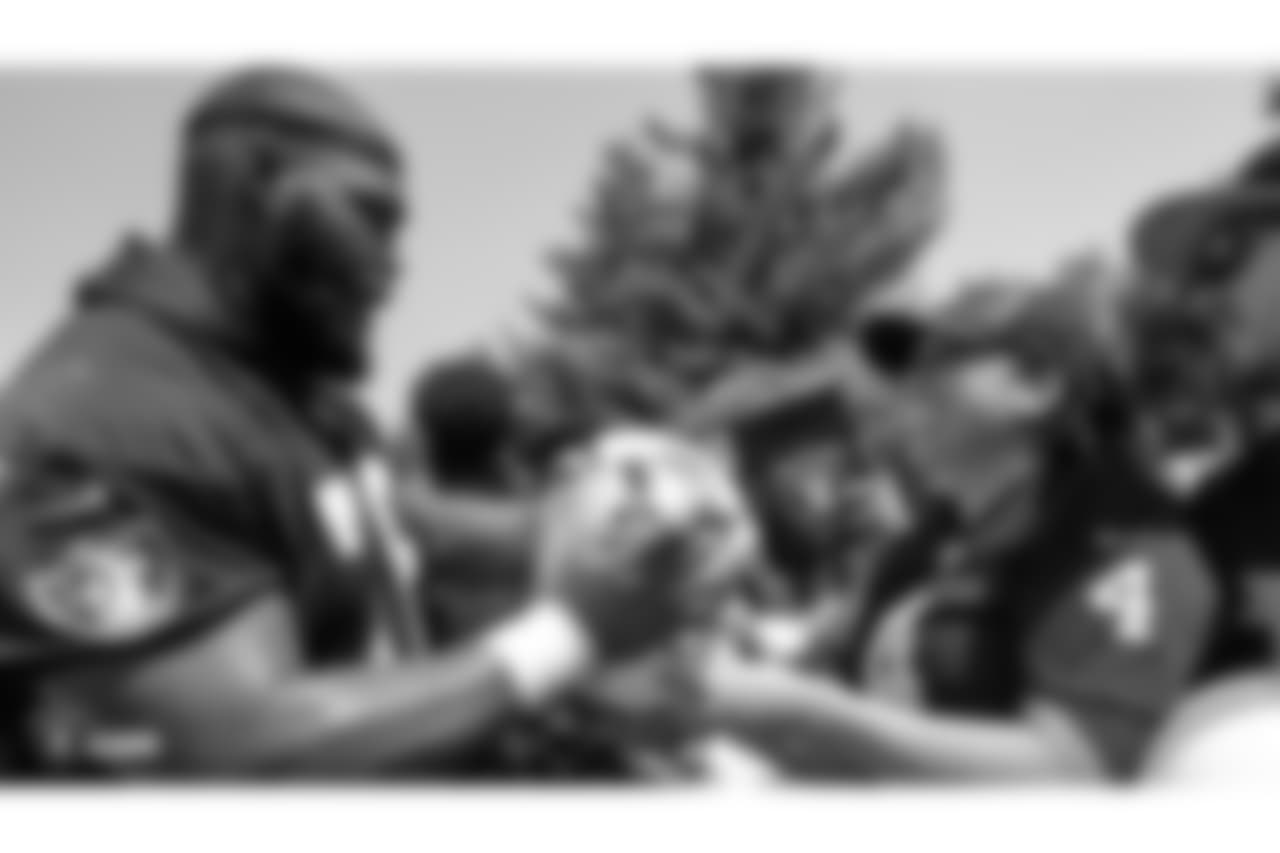 Oakland Raiders defensive tackle Justin Ellis (78) signs autographs for fans after practice at 2018 Training Camp at The Oakland Raiders Napa Valley Training Complex, Thursday, August 2, 2018, in Napa, California.