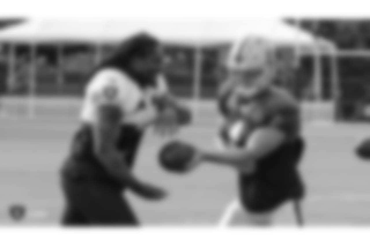 Oakland Raiders running back Marshawn Lynch (24) and quarterback Derek Carr (4) on the field for practice at 2018 Training Camp at The Oakland Raiders Napa Valley Training Complex, Wednesday, August 1, 2018, in Napa, California.