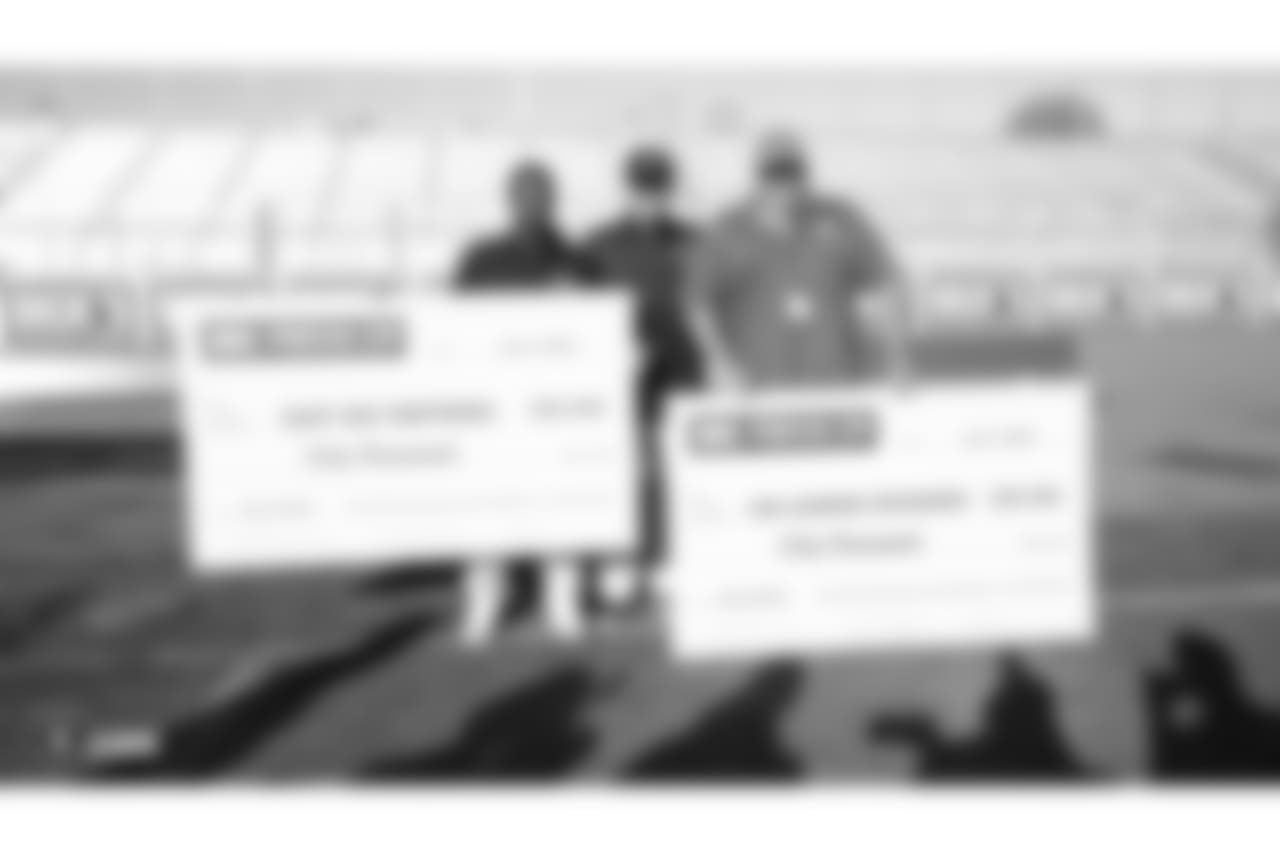 The Oakland Raiders head coach Jon Gruden presents a donation of football gear and checks for $50,000 by Dicks Sporting Goods Foundation's Sports Matters to both San Leandro Crusaders and East Bay Panthers' youth football teams. Accepting the donations were the San Leandro Crusaders' head coach Daniel Rivera and East Bay Panthers' head coach Jacob Davis, at Burrell Field, Tuesday, July 17, 2018, in San Leandro, California.