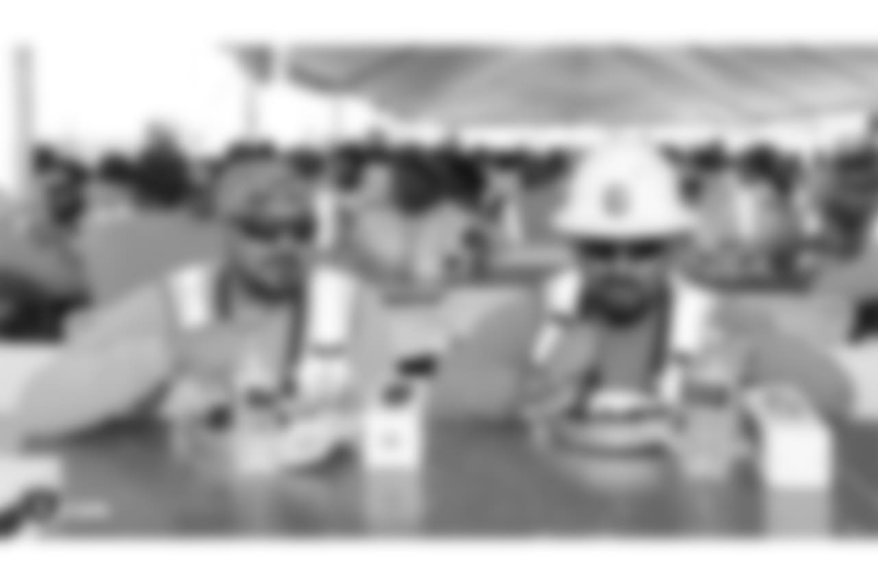 Staff members from The Oakland Raiders front office spend the day with construction workers of the Las Vegas Stadium worksite by handing out lunches and sharing a meal, Wednesday, June 28, 2018, at the Las Vegas Stadium worksite in Las Vegas, Nevada.