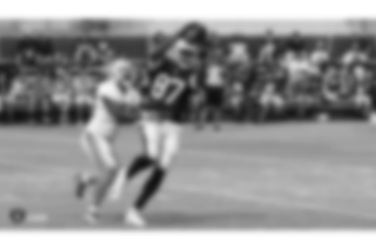 Oakland Raiders tight end Jared Cook (87) with Detroit Lions player (41) strong safety Rolan Mullingan on the field for practice at 2018 Training Camp at The Oakland Raiders Napa Valley Training Complex, Wednesday, August 8, 2018, in Napa, California.