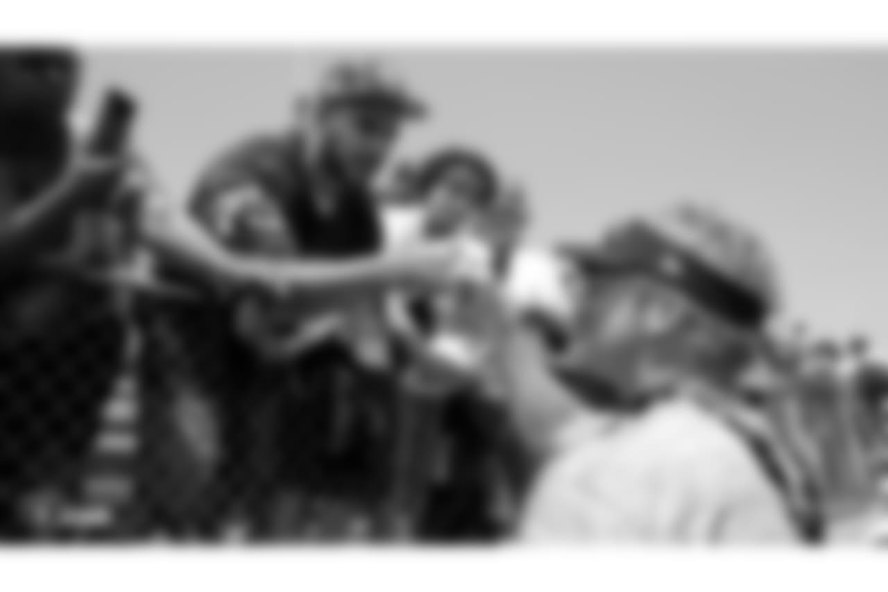 Oakland Raiders head coach Jon Gruden signs autographs for fans after practice at 2018 Training Camp at Memorial Stadium, Saturday, July 28, 2018, in Napa, California.