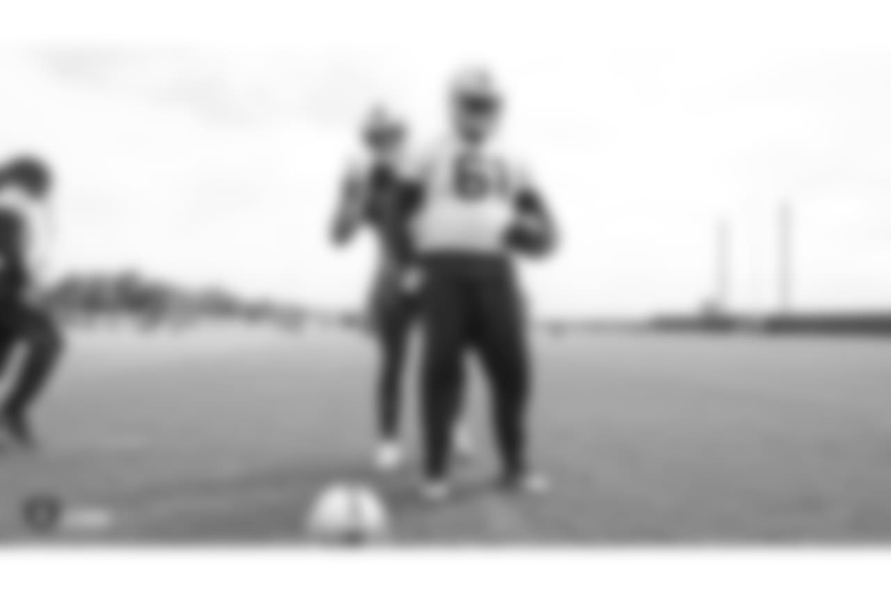 Oakland Raiders quarterback Derek Carr (4) and center Rodney Hudson (61) at an Organized Team Activity (OTA) at the Oakland Raiders Practice Facility, Wednesday, May 30, 2018, in Alameda, California.