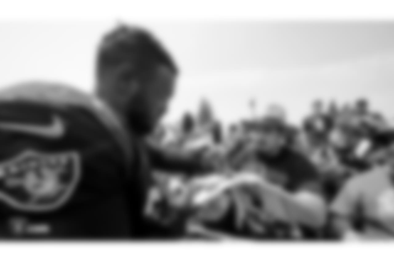 Oakland Raiders defensive tackle Maurice Hurst (73) signs autographs for fans after practice at 2018 Training Camp at The Oakland Raiders Napa Valley Training Complex, Sunday, July 29, 2018, in Napa, California.