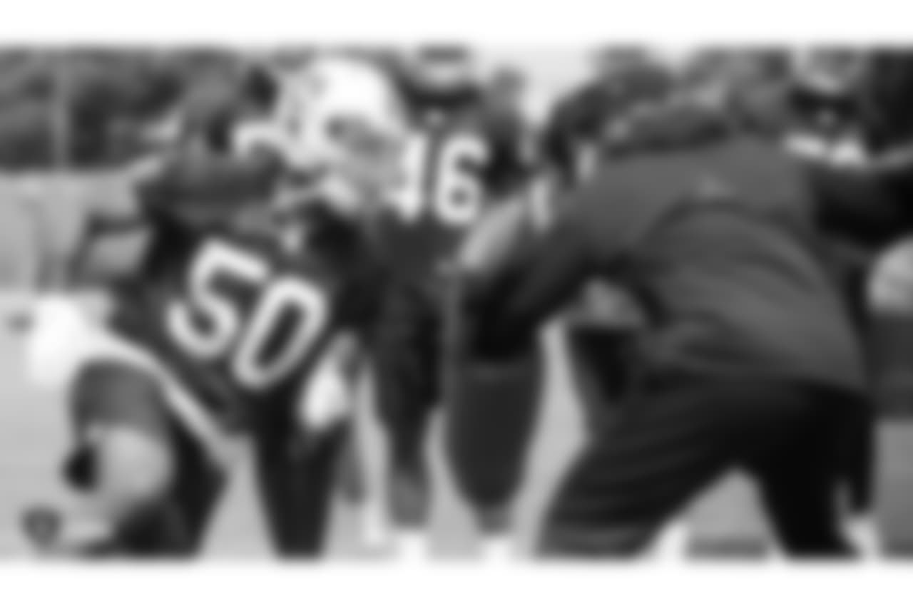 Oakland Raiders assistant defensive line coach Marco Coleman and linebacker Nicholas Morrow (50) at an Organized Team Activity (OTA) at the Oakland Raiders Practice Facility, Wednesday, May 30, 2018, in Alameda, California.