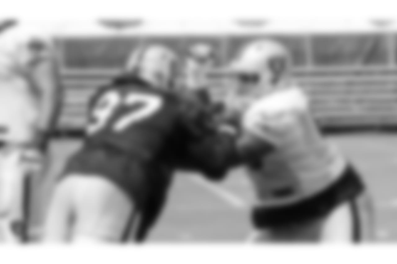 Oakland Raiders defensive end Mario Edwards Jr. (97) and offensive guard Gabe Jackson (66) on the field for practice at 2018 Training Camp at The Oakland Raiders Napa Valley Training Complex, Thursday, August 2, 2018, in Napa, California.