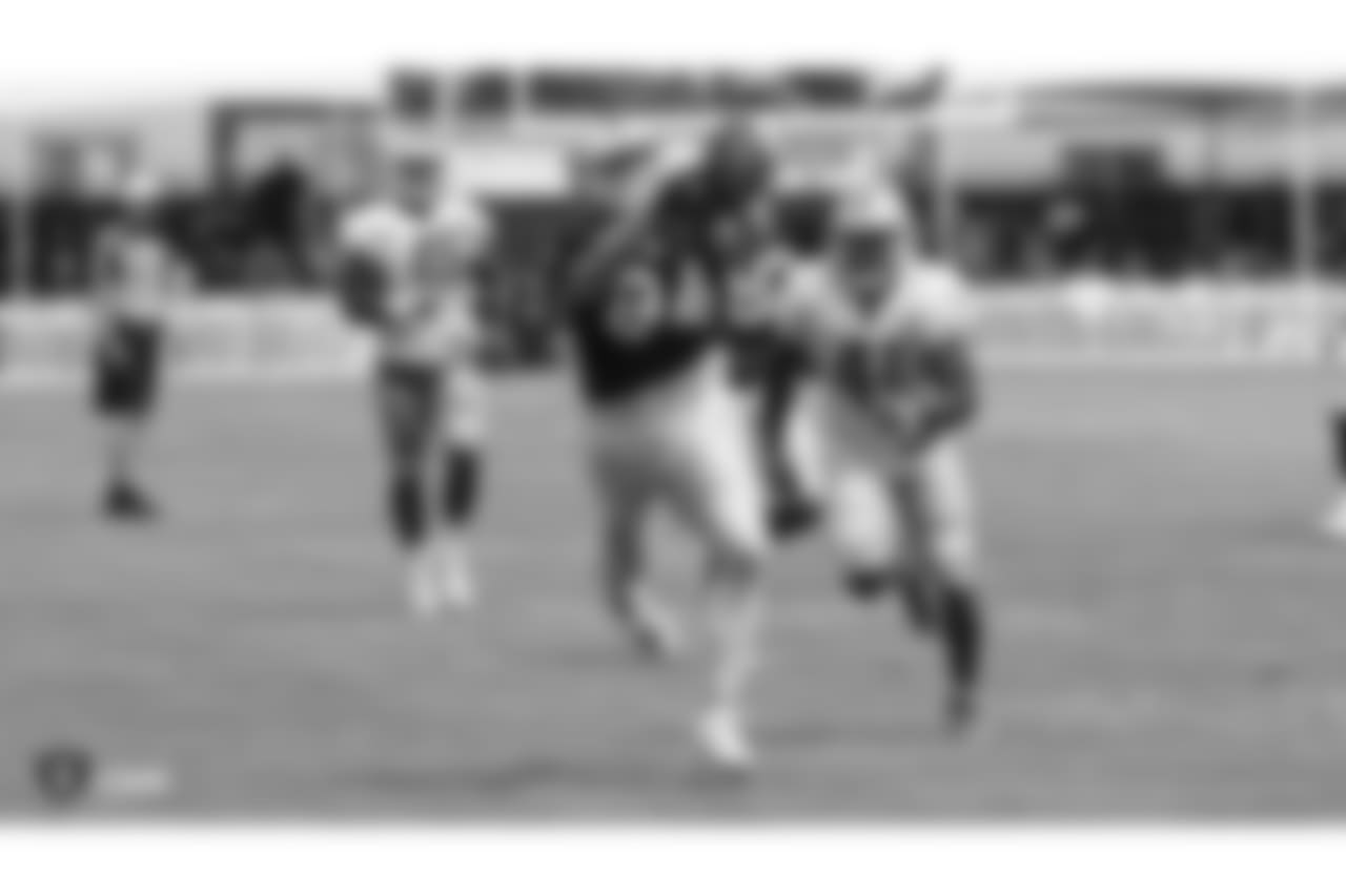 Oakland Raiders tight end Paul Butler (84) with Detroit Lions (41) strong safety Rolan Mulligan on the field for practice at 2018 Training Camp at The Oakland Raiders Napa Valley Training Complex, Wednesday, August 8, 2018, in Napa, California.