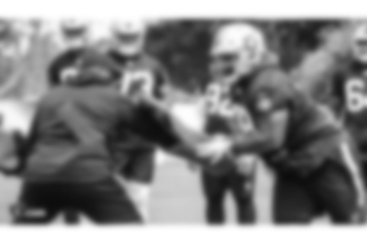 Oakland Raiders assistant defensive line coach Marco Coleman and defensive tackle Justin Ellis (78) at an Organized Team Activity (OTA) at the Oakland Raiders Practice Facility, Wednesday, May 30, 2018, in Alameda, California.